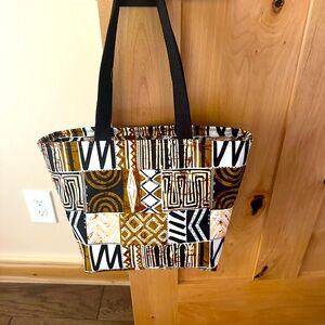 Handmade zippered tote With lining and zippered inside pocket w another pocket.